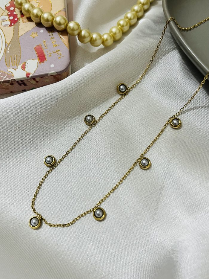 Titanium 22k gold polished stainless steel imported pendant with 6 months color guarantee.