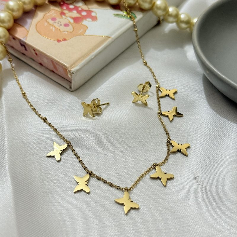 Titanium 22k gold polished imported pendant earrings set with 6 months color guarantee.